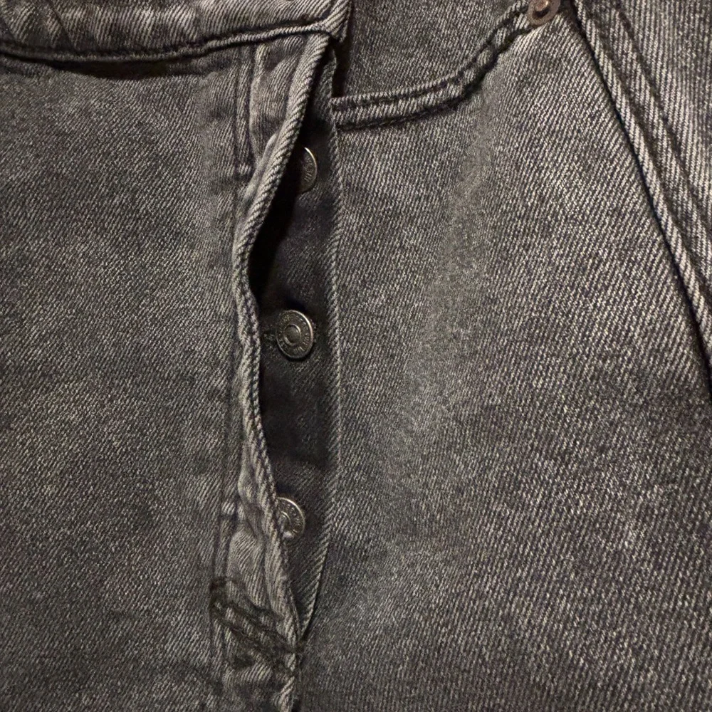 We The Free Black Frayed Asymmetrical Wrap Mini with Button Fly Closure. - Picture 4 of 5